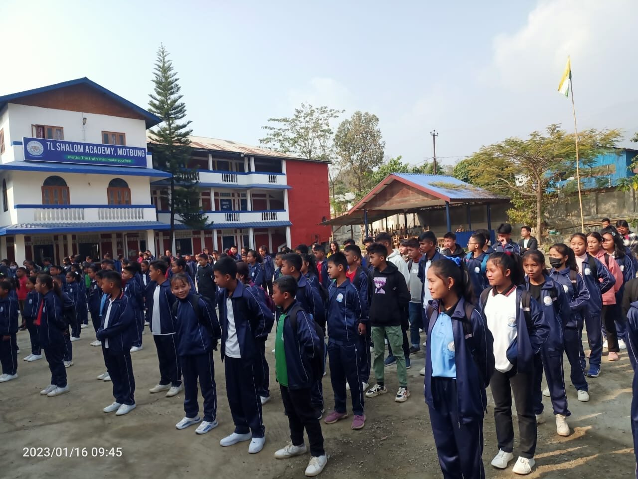 Students assembled outside the academy buildings in Motbung.